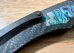 Heretic Custom Pariah Manual V2 Wood Grain San Mai Carbon Fiber Abalone Inlay (Blade Show) -Helle Shop heretic knives heretic custom pariah manual v2 wood grain san mai carbon fiber abalone inlay blade show 39393557577940