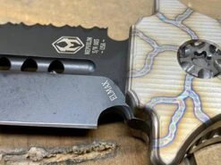 Heretic Nephilim Fixed Blade D/E Dagger Flamed Titanium Handle DLC Black Full Serrated Blade H003-6C-FTi -Helle Shop heretic knives heretic nephilim fixed blade d e dagger flamed titanium handle dlc black full serrated blade h003 6c fti 39393560461524